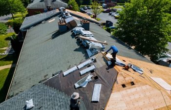 Construction worker on a renovation roof the house installed new shingles