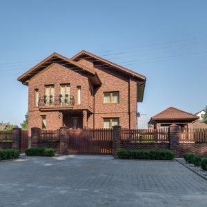 two-story concrete or brick country house